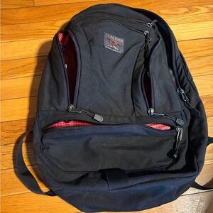 Tom Bihn Black Backpack with Red Interior Lining